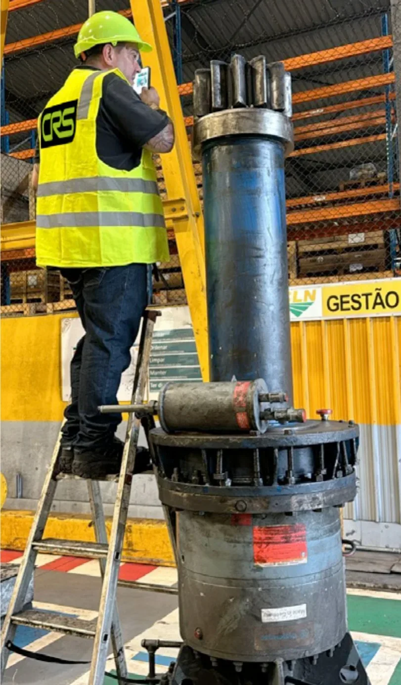 CRS technician working on a pump column